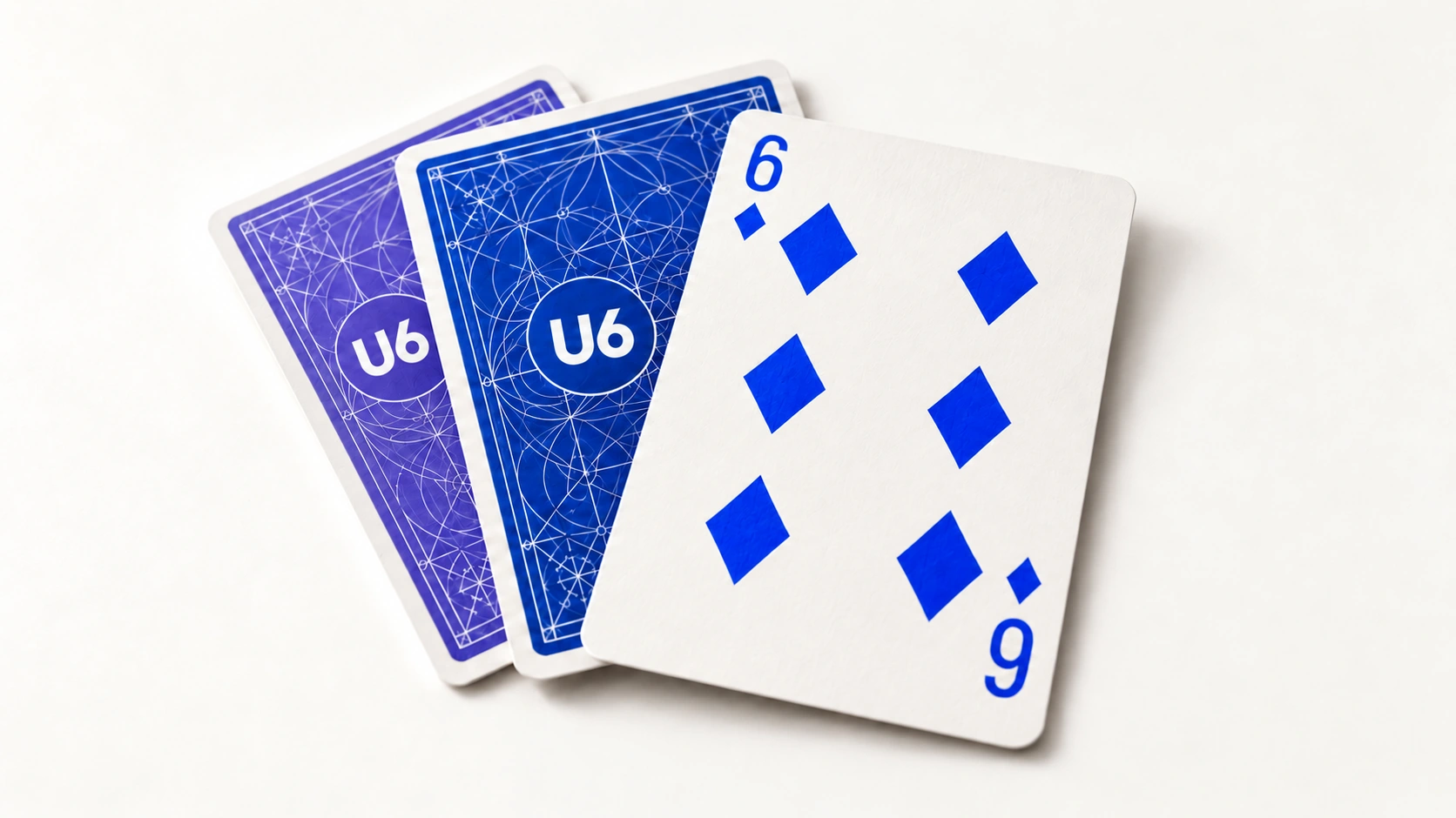 A face-up six of diamonds with poker-style corner indices beside cobalt and iris card backs printed with white U6 logos on a warm-white surface.